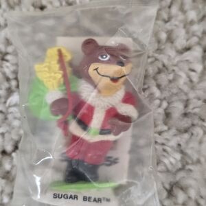 Sugar Bear Holiday Figure - Red Santa Suit with Green Gift